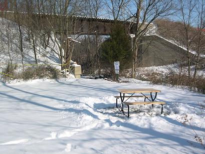 Snowy picnic spot by the trestle